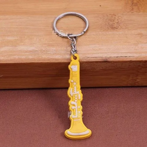 Брелок резиновый Кларнет. Цвет желтый.